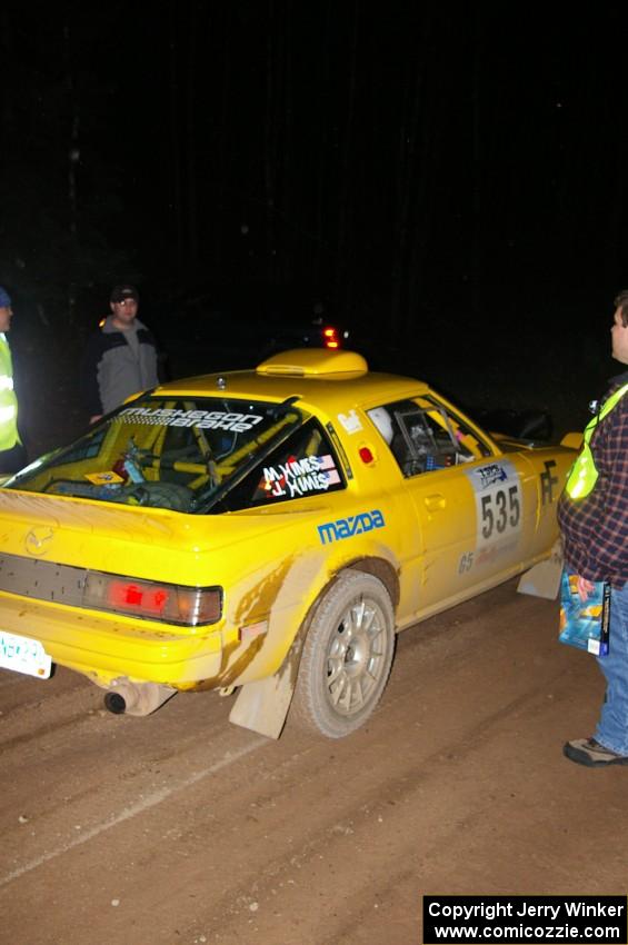 Jake Himes / Matt Himes Mazda RX-7 checks into the finish control of SS4, Baraga Plains.