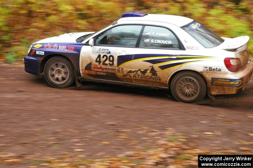 Tanner Foust / Scott Crouch Subaru WRX drifts into the final corner of SS7, Gratiot Lake 1.