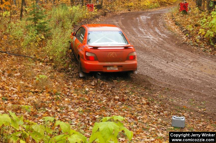 Matthew Johnson / Wendy Nakamoto Subaru WRX hits a greasy spot at the final corner of SS7, Gratiot Lake 1