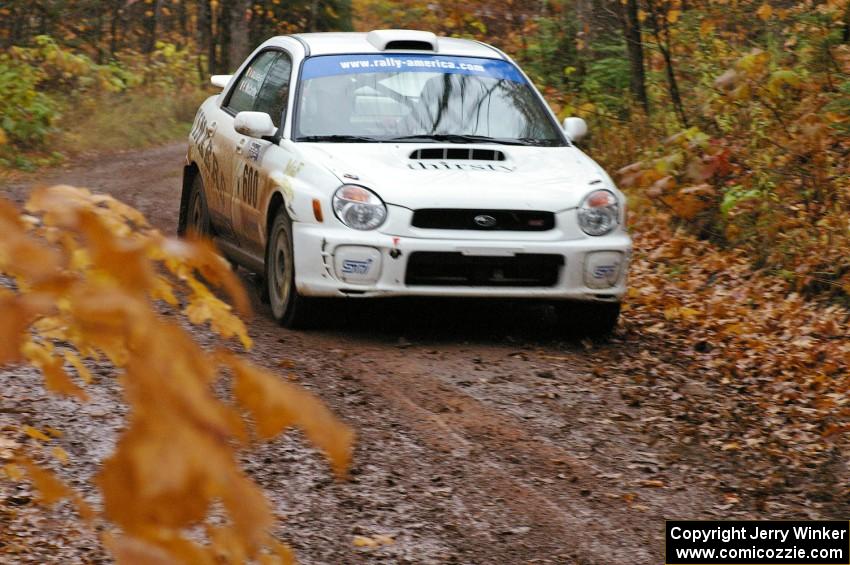 Fintan McCarthy / Noel Gallagher Subaru WRX STi nears the final corner of Gratiot Lake 1, SS7.