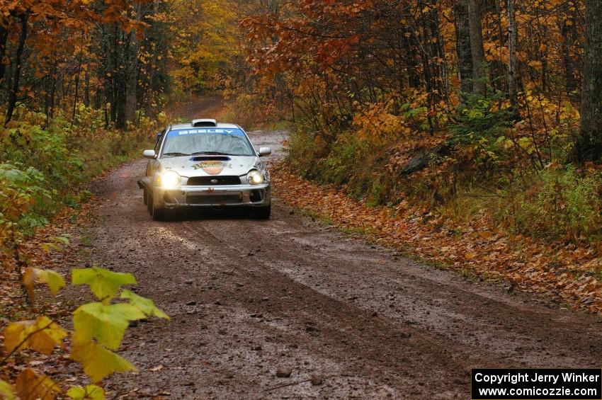 Fintan Seeley / Paddy McCague Subaru WRX STi races uphill in the final section of Gratiot Lake 1, SS7, before the finish.