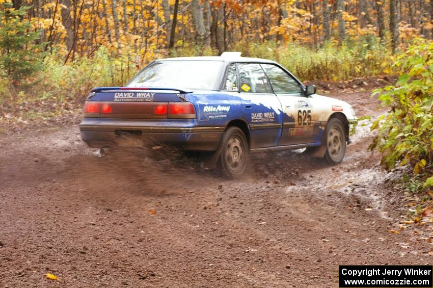 Mike Wray / Don DeRose Subaru Legacy Sport drifts the back end through the final muddy corner of Gratiot Lake 1, SS7.
