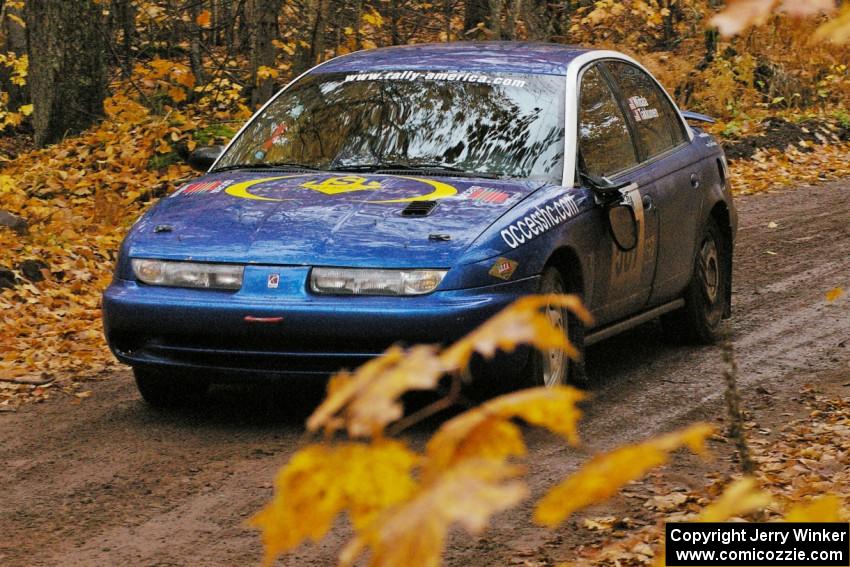 Micah Witala / Jason Takkunen Saturn SL2 slows down after crossing the finish of SS7, Gratiot Lake 1.