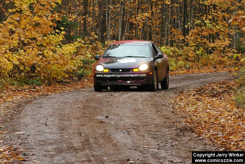 Sans Thompson / Craig Marr Dodge Neon ACR drives downhill after crossing the finish of Gratiot Lake 1, SS7.
