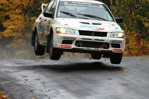 Alfredo De Dominicis / Massimo Daddoveri Mitsubishi Lancer Evo 7 catches nice air at the midpoint jump on Brockway, SS10.