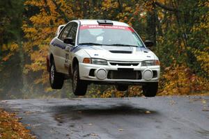 Chris Gilligan / Joe Petersen Mitsubishi Lancer Evo IV catches nice air at the midpoint jump on Brockway, SS10.