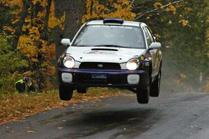 Tanner Foust / Scott Crouch Subaru WRX catches nice air at the midpoint jump on Brockway, SS10.