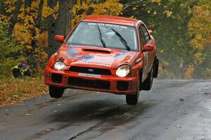 Matthew Johnson / Wendy Nakamoto catch air in their Subaru WRX at the midpoint jump on Brockway, SS10.