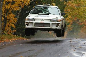 Henry Krolikowski / Cindy Krolikowski Subaru WRX catches nice air at the midpoint jump on Brockway, SS10.