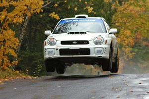 Fintan McCarthy / Noel Gallagher Subaru WRX STi gets nice air at the midpoint jump on Brockway, SS10.