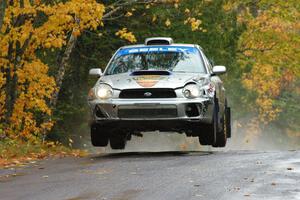 Fintan Seeley / Paddy McCague Subaru WRX STi catches decent air at the midpoint jump on Brockway, SS10.