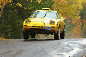 Jake Himes / Matt Himes	Mazda RX-7 takes it easy over the midpoint jump on Brockway, SS10.