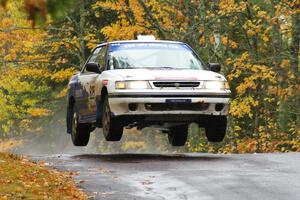 Mike Wray / Don DeRose Subaru Legacy Sport catches nice air at the midpoint jump on Brockway, SS10.