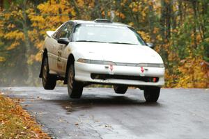 Chris Czyzio / Bob Martin Mitsubishi Eclipse GSX gets a little air at the midpoint jump on Brockway, SS10.