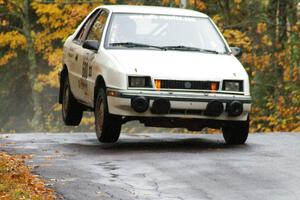 Greg Woodside / Tom Woodside Dodge Shadow Turbo gets minor air at the midpoint jump on Brockway, SS10.