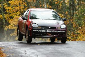 Sans Thompson / Craig Marr Dodge Neon ACR catch minor air at the midpoint jump on Brockway, SS10.