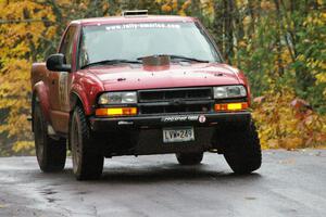 Jim Cox / Ryan LaMothe Chevrolet S-10 takes it easy over the midpoint jump on Brockway, SS10, due to suspension failure.
