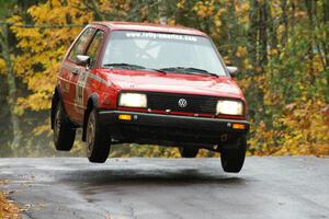 Paul Koll / Matt Wappler VW GTI gets decent air at the midpoint jump on Brockway, SS10.