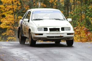 Colin McCleery / Nancy McCleery	Ford Sierra XR8 sticks to the pavement at the midpoint jump on Brockway, SS10.