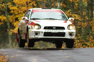 Yurek Cienkosz / Lukasz Szela Subaru Impreza RS catches a few inches of air at the midpoint jump on Brockway, SS10.