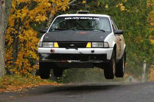Joel Sanford / Jeff Hribar Chevy Cavalier catches some nice air at the midpoint jump on Brockway, SS10.