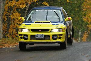 Joan Hoskinson / Jimmy Brandt Subaru Impreza RS gets the backend light at the midpoint jump on Brockway, SS10.