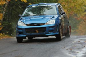 Adam Boullion / Phil Boullion Ford Focus keeps it to the pavement at the midpoint jump on Brockway, SS10.
