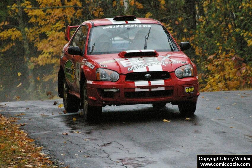 Pat Richard / Nathalie Richard risk nothing while leading at the midpoint jump on Brockway, SS10, in their Subaru WRX STi.