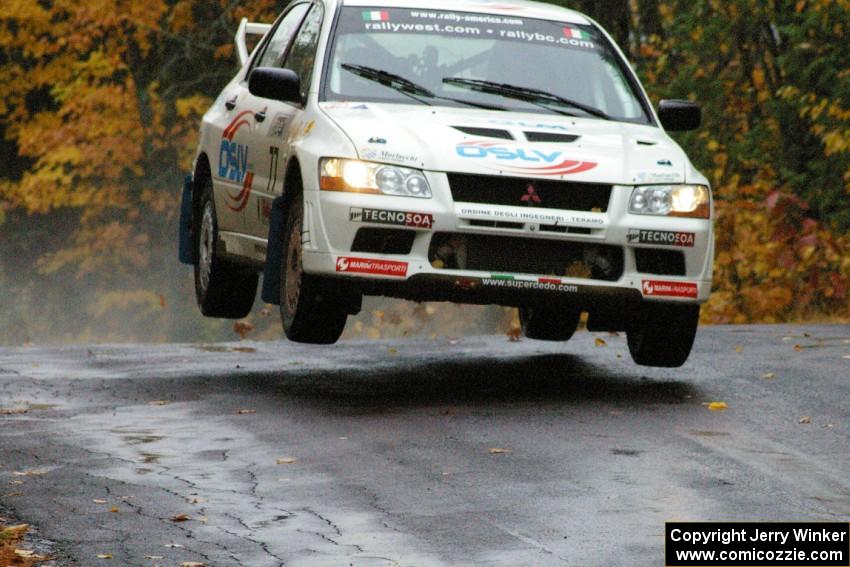 Alfredo De Dominicis / Massimo Daddoveri Mitsubishi Lancer Evo 7 catches nice air at the midpoint jump on Brockway, SS10.