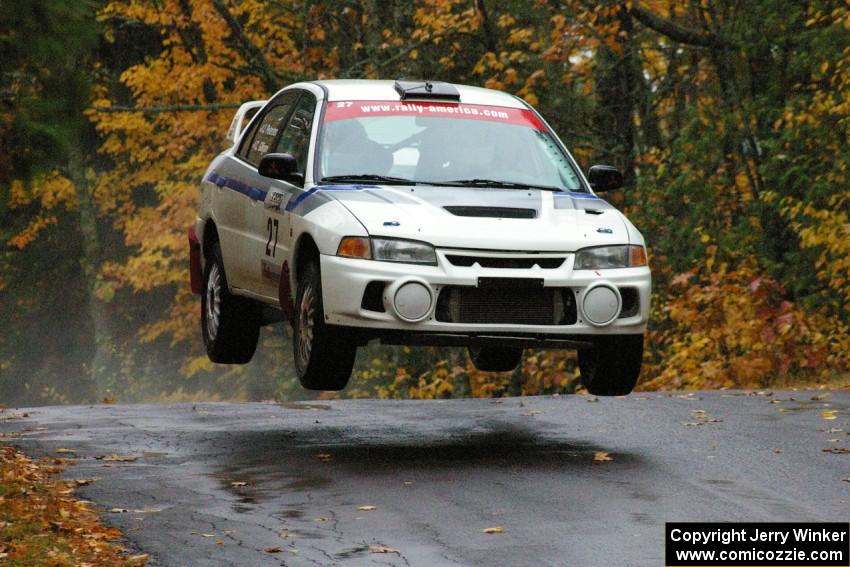 Chris Gilligan / Joe Petersen Mitsubishi Lancer Evo IV catches nice air at the midpoint jump on Brockway, SS10.