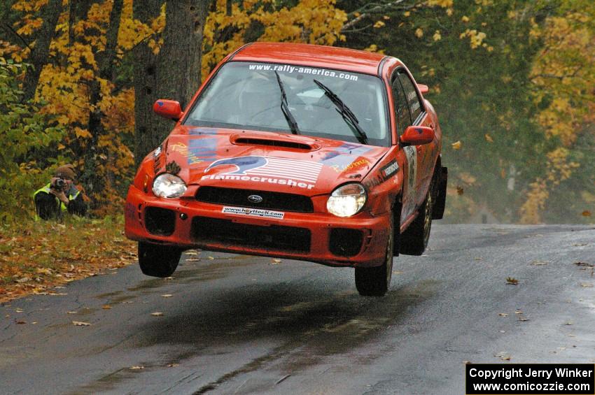 Matthew Johnson / Wendy Nakamoto catch air in their Subaru WRX at the midpoint jump on Brockway, SS10.