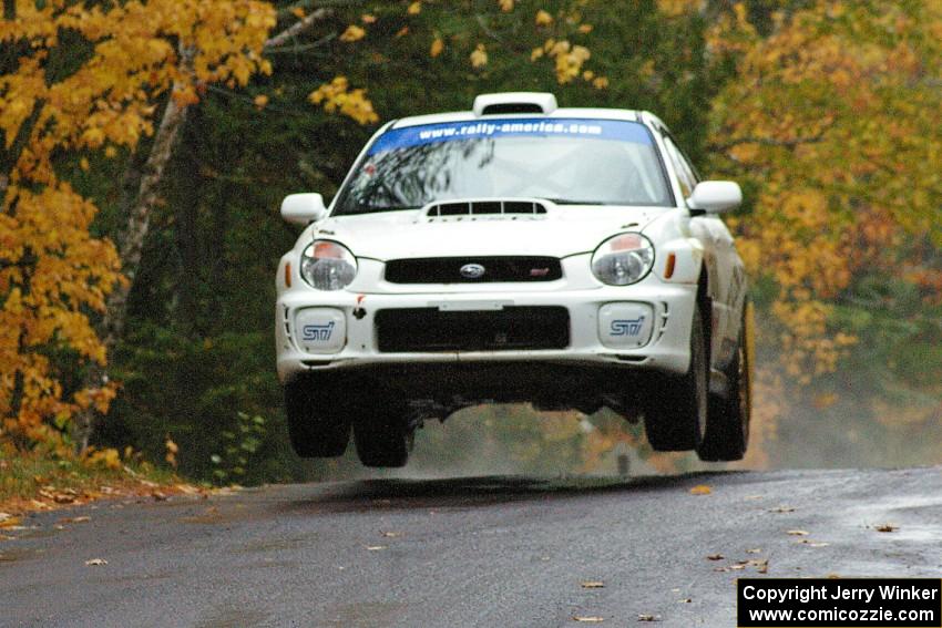 Fintan McCarthy / Noel Gallagher Subaru WRX STi gets nice air at the midpoint jump on Brockway, SS10.