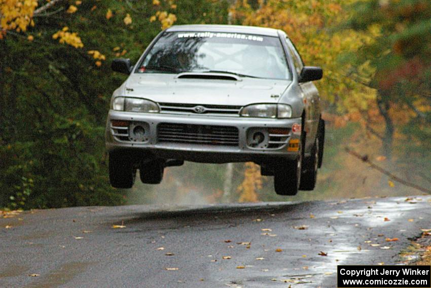 Russ Hodges / Mike Rossey Subaru Impreza catches nice air at the midpoint jump on Brockway, SS10.