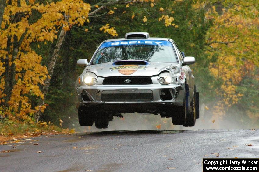 Fintan Seeley / Paddy McCague Subaru WRX STi catches decent air at the midpoint jump on Brockway, SS10.