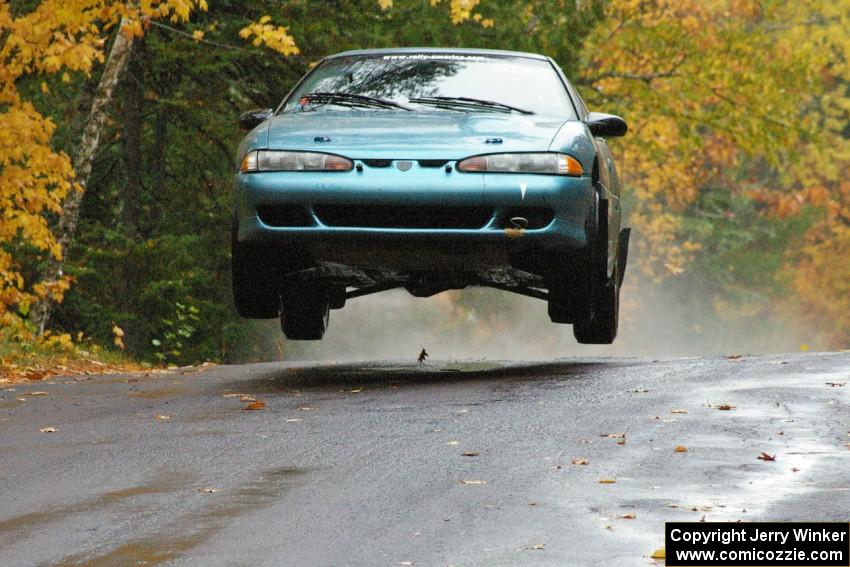 Adam Markut / John Nordlie Eagle Talon TSI catches major air at the midpoint jump on Brockway, SS10.