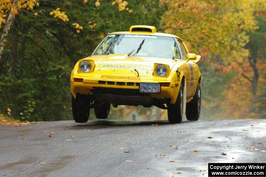 Jake Himes / Matt Himes	Mazda RX-7 takes it easy over the midpoint jump on Brockway, SS10.