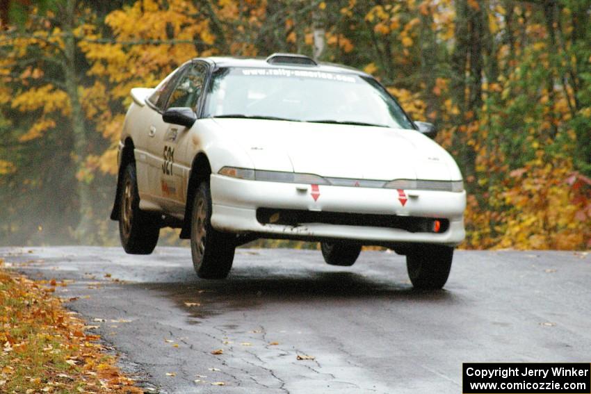 Chris Czyzio / Bob Martin Mitsubishi Eclipse GSX gets a little air at the midpoint jump on Brockway, SS10.