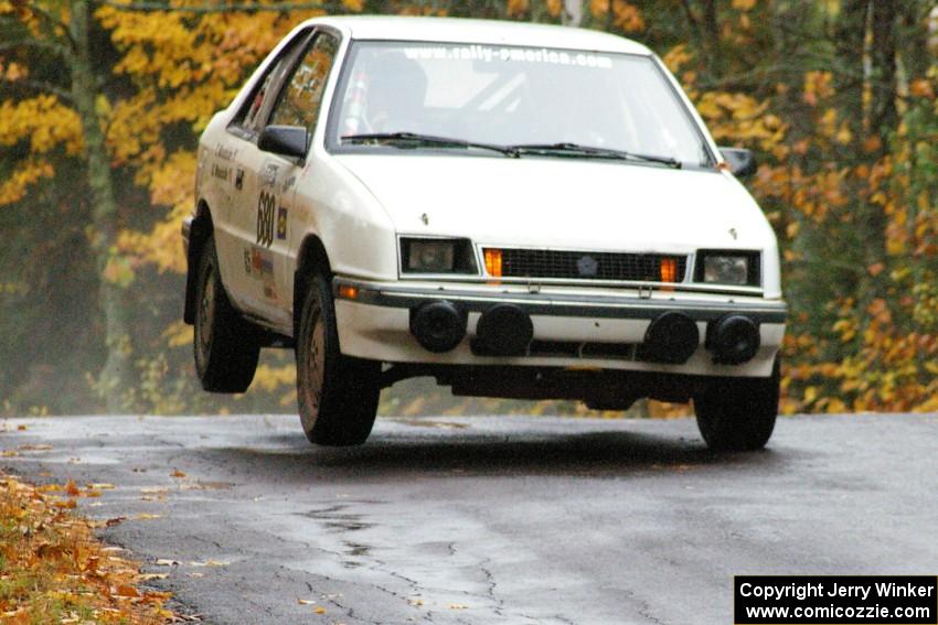 Greg Woodside / Tom Woodside Dodge Shadow Turbo gets minor air at the midpoint jump on Brockway, SS10.