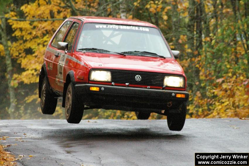 Paul Koll / Matt Wappler VW GTI gets decent air at the midpoint jump on Brockway, SS10.