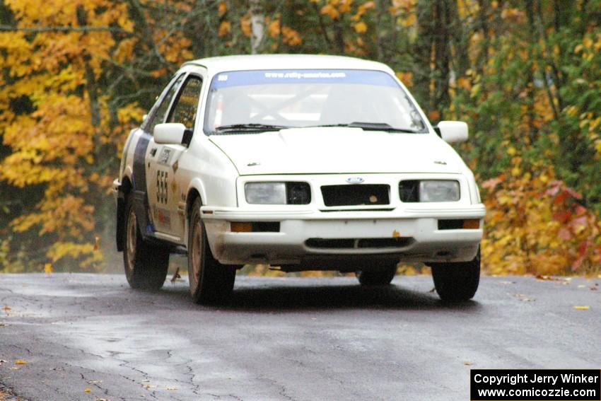 Colin McCleery / Nancy McCleery	Ford Sierra XR8 sticks to the pavement at the midpoint jump on Brockway, SS10.