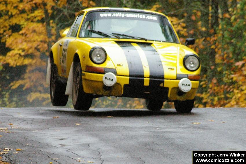 Bob Cutler / John Atsma Porsche 911S gets the right side light at the midpoint jump on Brockway, SS10.