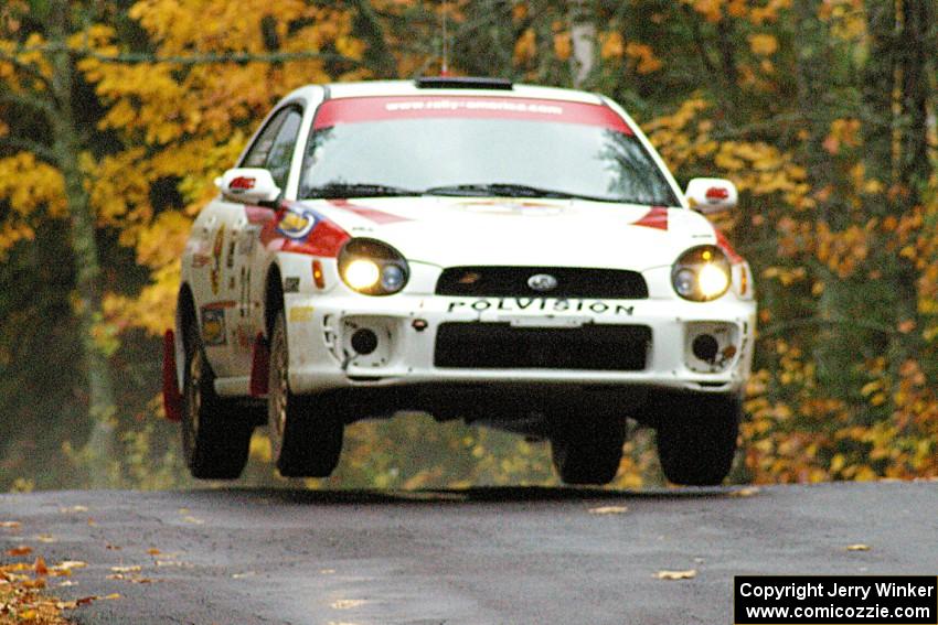 Yurek Cienkosz / Lukasz Szela Subaru Impreza RS catches a few inches of air at the midpoint jump on Brockway, SS10.