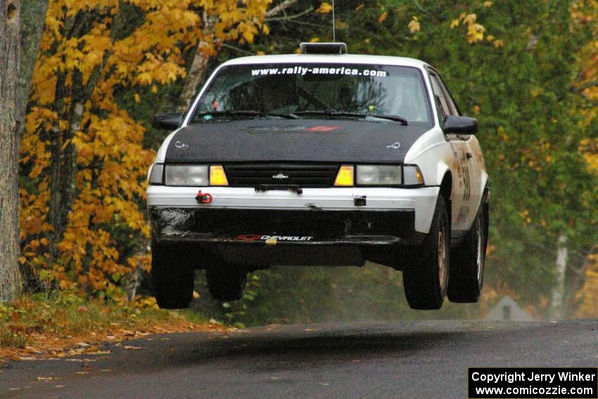 Joel Sanford / Jeff Hribar Chevy Cavalier catches some nice air at the midpoint jump on Brockway, SS10.