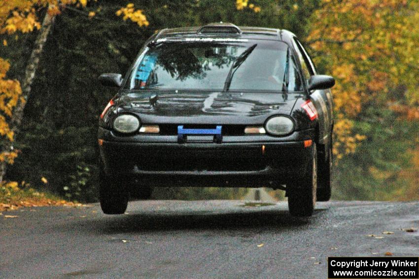 Bryan Holder / Tracy Payeur Plymouth Neon gets a little air at the midpoint jump on Brockway, SS10.