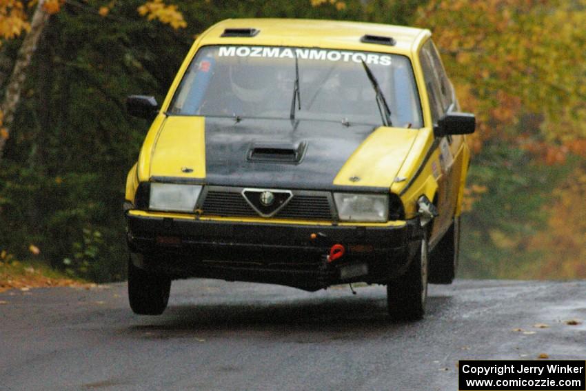 Eric Mozer / Jay Efting	Alfa Romeo Milano catches a few inches of air at the midpoint jump on Brockway, SS10.