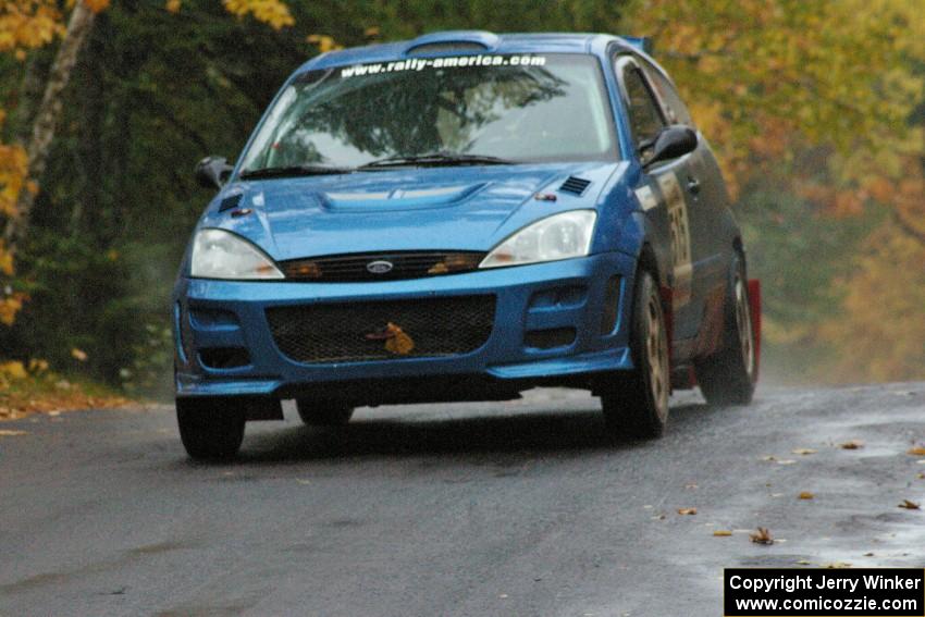 Adam Boullion / Phil Boullion Ford Focus keeps it to the pavement at the midpoint jump on Brockway, SS10.