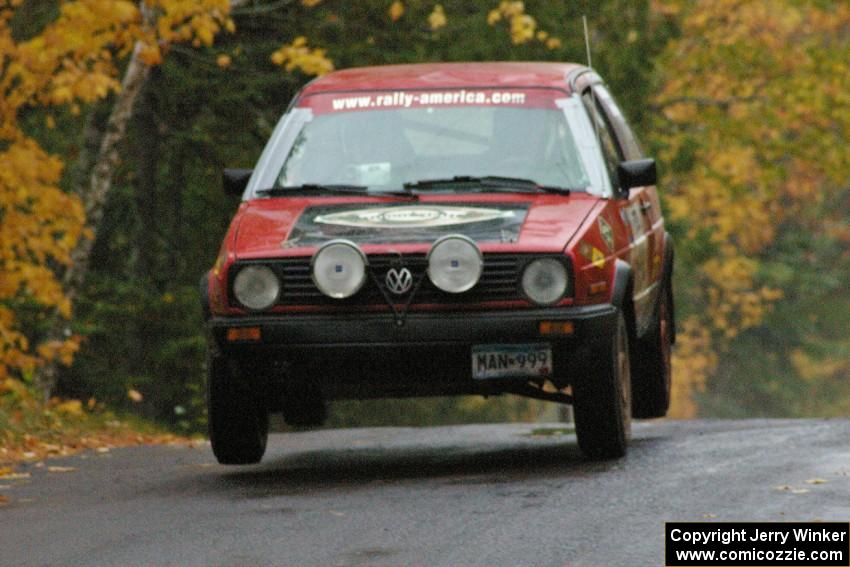 Dave Grenwis / Dan Goldman VW GTI catches some air at the midpoint jump on Brockway, SS10.