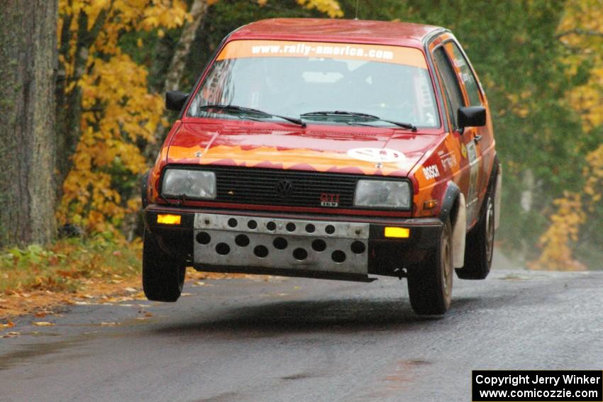 Joe Sladovich/ Kent Gardam VW GTI catches decent air at the midpoint jump on Brockway, SS10.