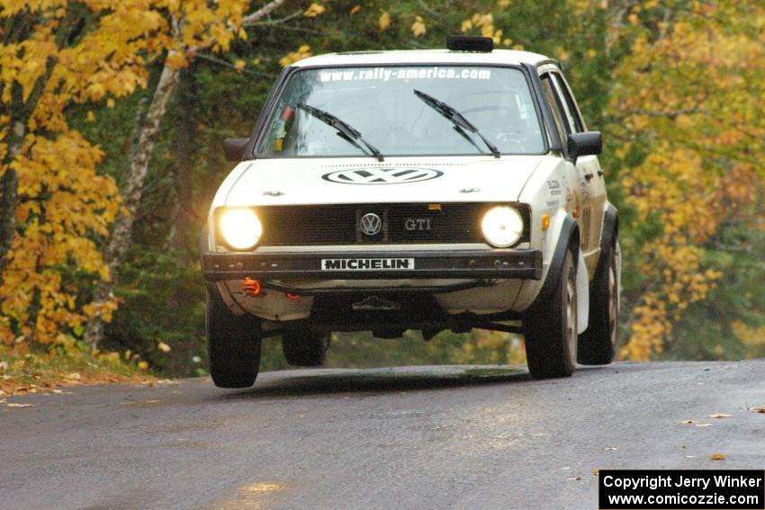 Brett Fairbanks / Chris Greenhouse VW Rabbit catch a couple inches of air at the midpoint jump on Brockway, SS10.