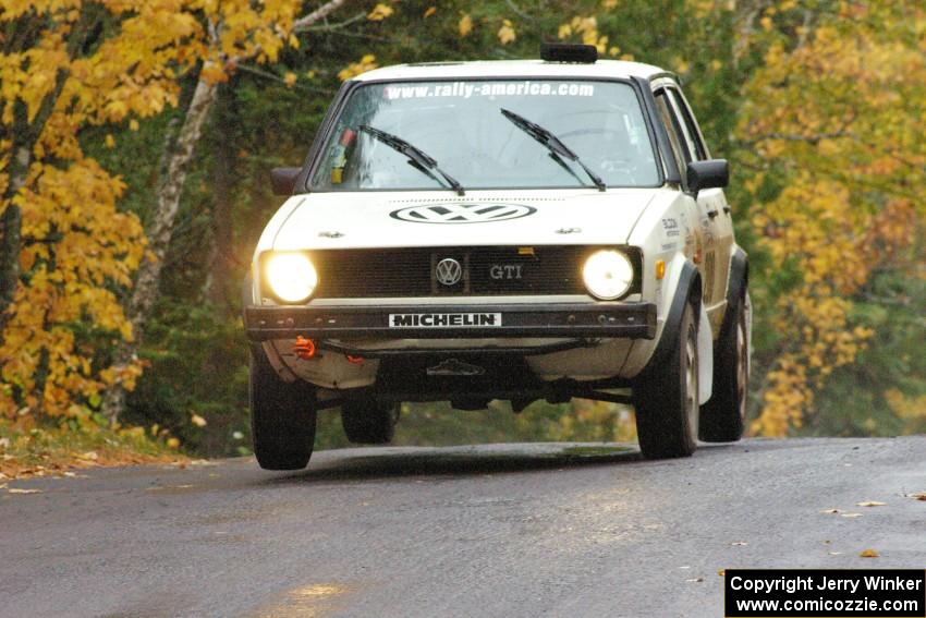 Brett Fairbanks / Chris Greenhouse VW Rabbit catch a couple inches of air at the midpoint jump on Brockway, SS10.